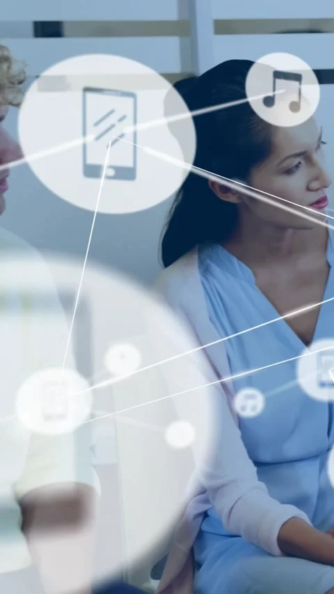 Vertical video: Pullback showing seated woman turning, causing network icons Stock Footage 330965609