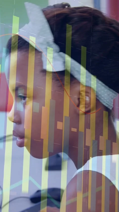 Vertical video: Pupil typing at desk, bars appearing, she turning to camera and Stock Footage 332734804