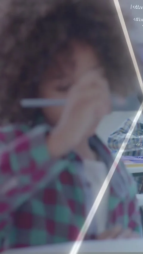 Vertical video: Pupil writing with pen at desk, pausing to think and causing Vídeos de archivo 331238493