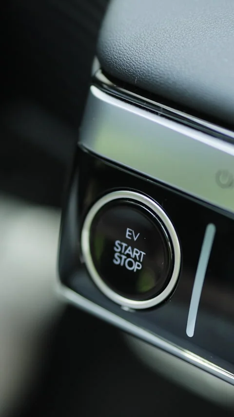 Vertical Video of Pushing start stop Button to start keyless ignition hybrid car Stock Footage 306740705