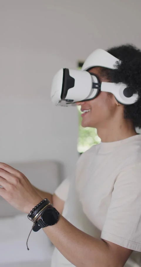 Vertical video: Putting on VR headset African American man reaching pointing Stock Footage 337259945