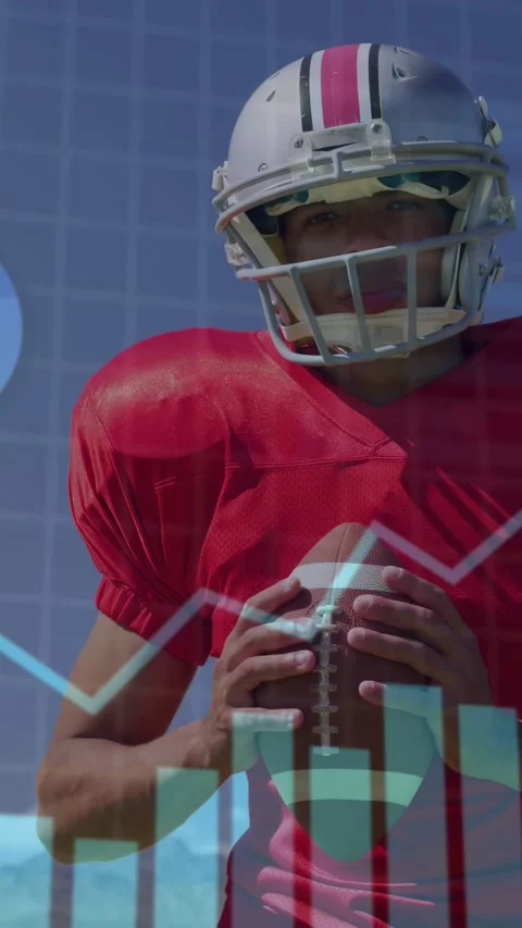 Vertical video: QB holding ball shifting grip while camera pull and overlay Stock Footage 333596190