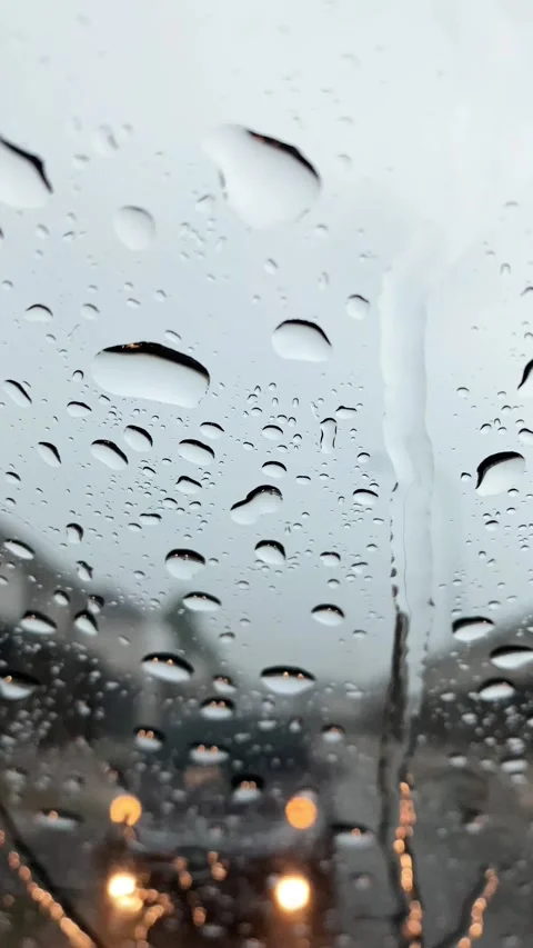 Vertical video of raindrops on a car windshield. Stock Footage 303805117
