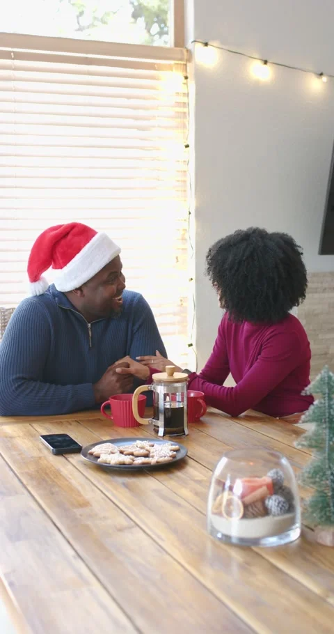 Vertical video: Reaching into pocket, couple sliding ring on table at home Stock Footage 343473168