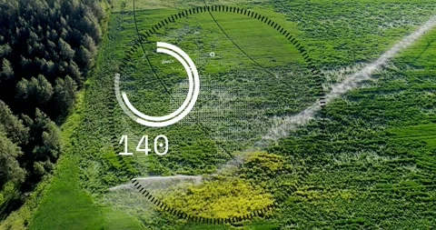 Vertical video: Reacting to cloud graphic, AR HUD updating readout over meadow, Stock Footage 331165516