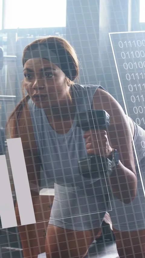 Vertical video: Reacting to data HUD, woman doing dumbbell row in gym, tank top Stock Footage 332806333