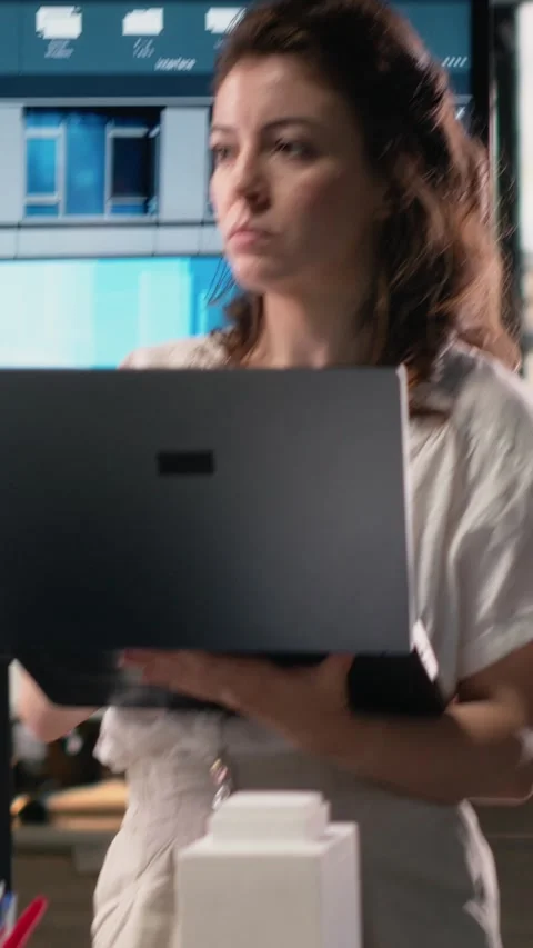 Vertical Video Real estate developer reviewing architectural blueprints and Stock Footage 316183811