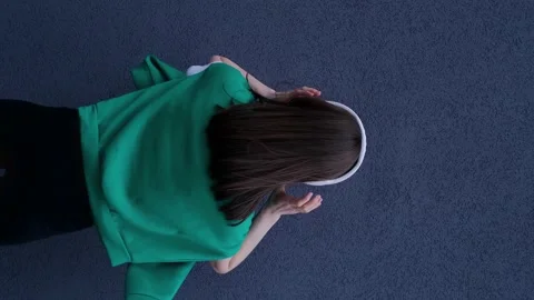 Vertical video rear view of a happy girl dancing and listening to audio in headp Stock Footage 239066034