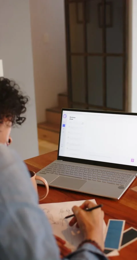 Vertical video: Receiving prompt, nonbinary artist drawing layout with pencil at Stock Footage 346723748