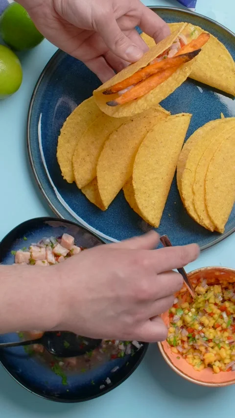 Vertical video recipes: the cook makes homemade tacos with salmon and spicy Stock Footage 179922734