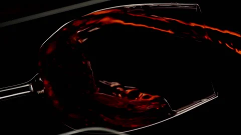 Vertical video of red wine pouring into glass angle shot slow motion Stock Footage 204786756