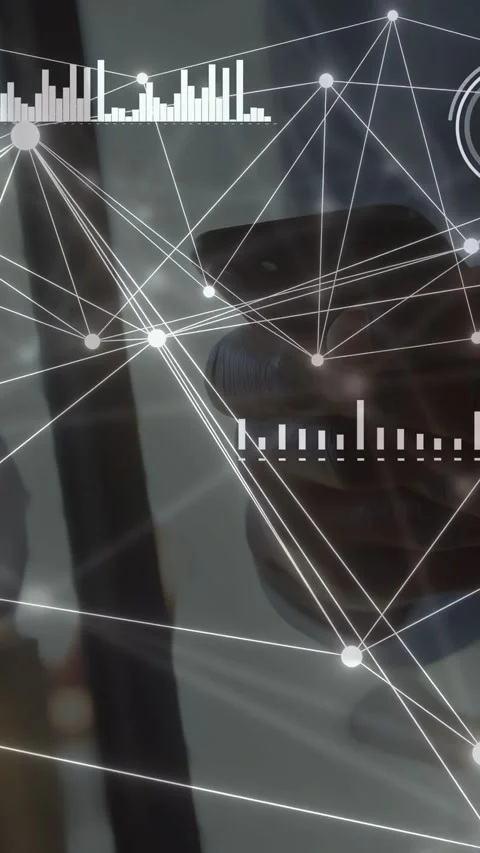 Vertical video: Reflected man using device in tech, AR nodes moving gauge Stock Footage 334792850