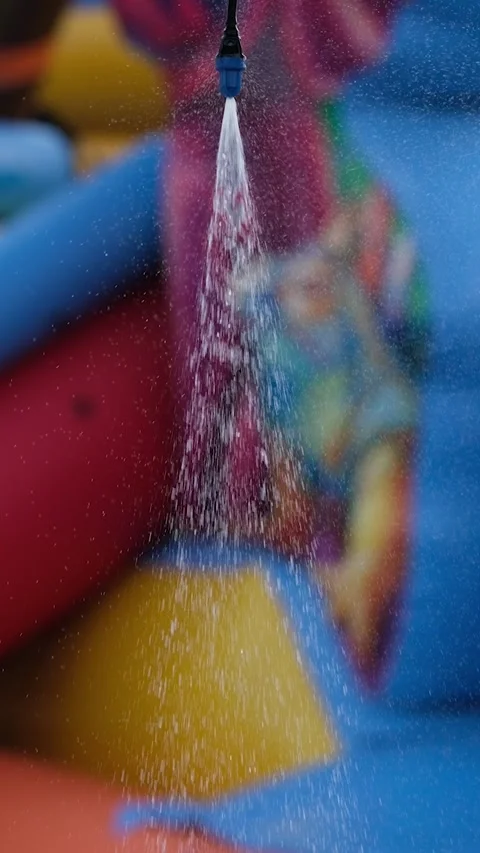 Vertical video. Refreshing shower by the outdoor summer pool, close-up. Stock Footage 278511649