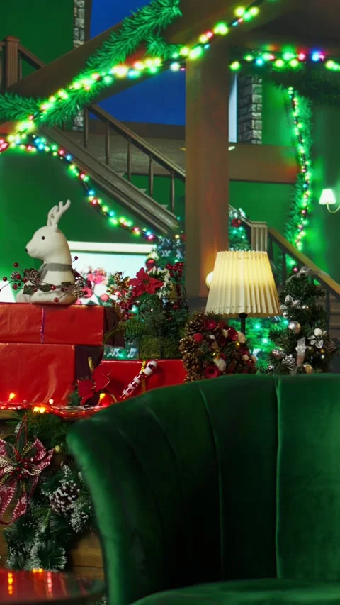 Vertical video Reindeer toy in empty room decorated with Christmas tree, panning Stock Footage 316267469