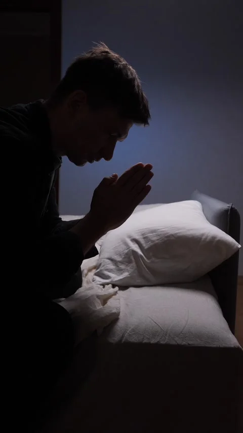Vertical video Religious man praying with hands joined at home Stock Footage 317724387