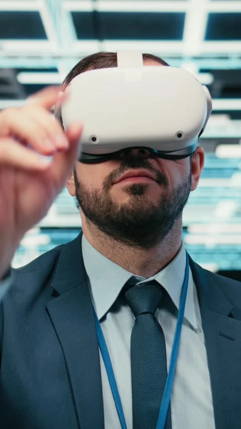 Vertical video Removing VR goggles, finishing task and software developer in Stock Footage 329713077