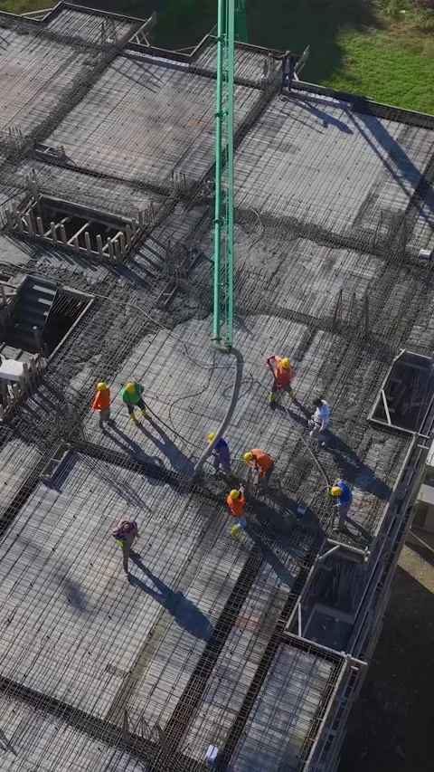 Vertical Video of Residential Construction With Engineers Reviewing Plans and Video stock 342729124
