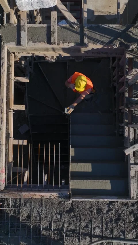 Vertical Video of Residential Construction With Workers and a Crane Lifting Stock Footage 342714053