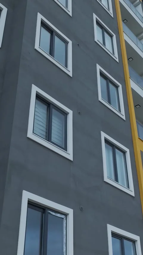 Vertical Video Residential Facade Close View with Windows Pattern Stock Footage 341851075