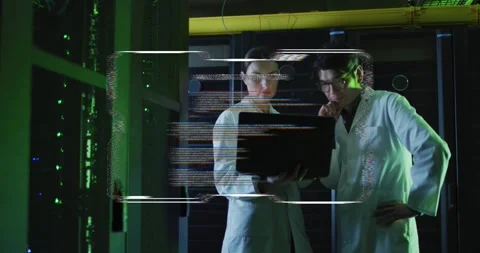 Vertical video: Responding to HUD, duo in white coats checking laptop in data Stock Footage 334115701