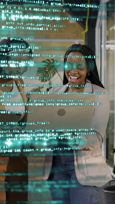 Vertical video: Right dev reviewing tech code, angling laptop to peer, typing, Stock Footage 334378546