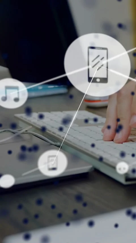 Vertical video: Right hand typing on keys sparking phone music icons forming Stock Footage 331046978