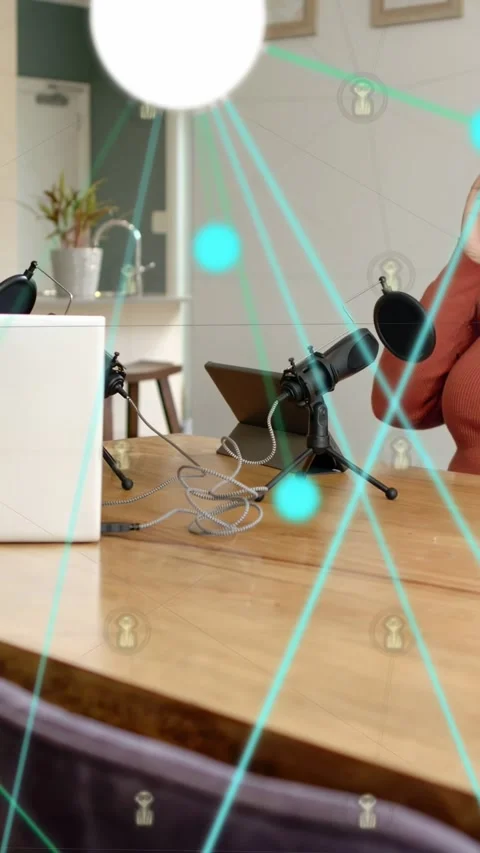 Vertical video: Right host leaning to mic causing blue overlay over mics while Stock Footage 333259960