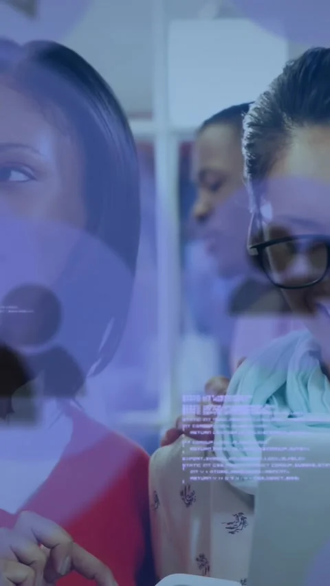 Vertical video: Right rep opening laptop showing shop demo to left peer with top Stock Footage 331030207