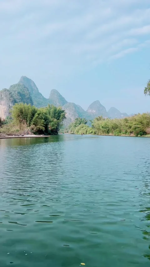 Vertical Video of Rippling Lake Surface with Karst Mountains in Guilin Stock Footage 328439788