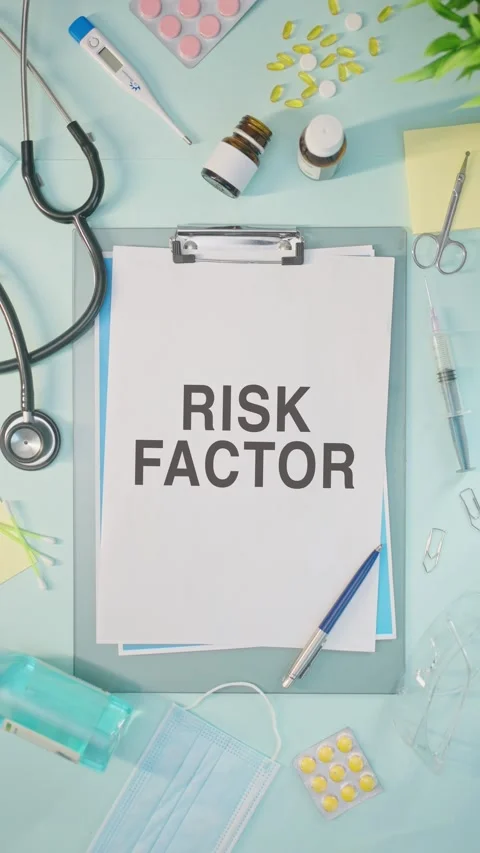 VERTICAL VIDEO OF RISK FACTOR WRITTEN ON MEDICAL PAPER Stock Footage 308108226