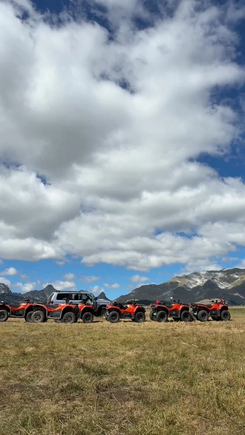 Vertical video of off road ATVs lined up in stunning highland scenery Stock Footage 319402637