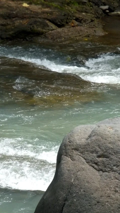 Vertical video of rocks in river for product placement Видео 336877821