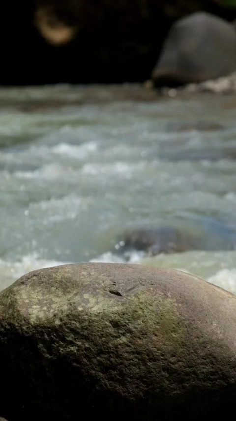 Vertical video of rocks in river for product placement Stock Footage 336877843