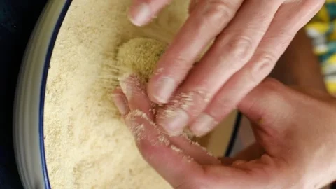 Vertical video. Rolling a potato and bacon patty in a breadcrumbs. Stock Footage 305154711