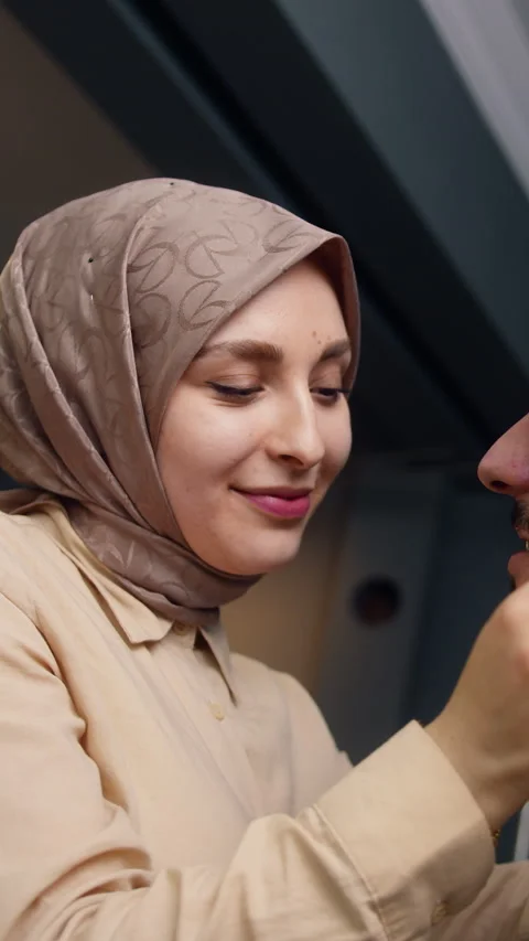 Vertical video. Romantic young married couple standing at home, the woman c.. Stock Footage 270937950