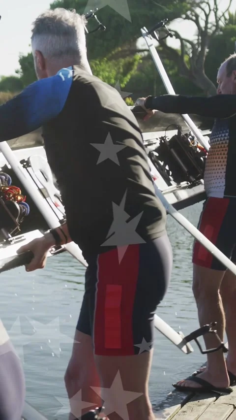 Vertical video: Rowing team carrying shell along dock after lifting hull from Stock Footage 333542036