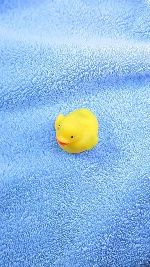Vertical video of rubber duck towel background Stock Footage 245079754