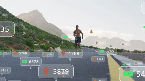 Vertical video: Runner approaching on mountain rd starting overlays updating Stock Footage 333078516