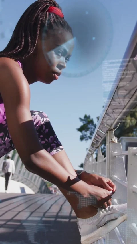 Vertical video: Runner bending at span tying shoe overlay appearing over face Stock Footage 334386947