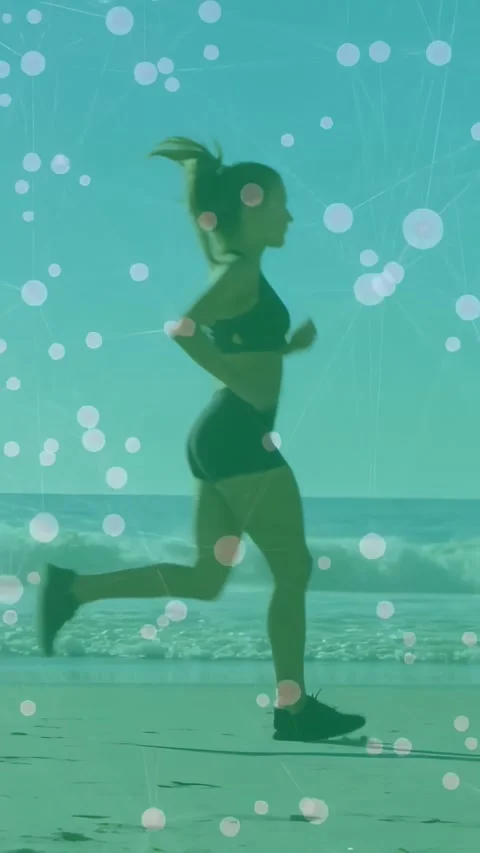 Vertical video: Runner entering left, jogging along beach, teal bokeh lines Stock Footage 330359433