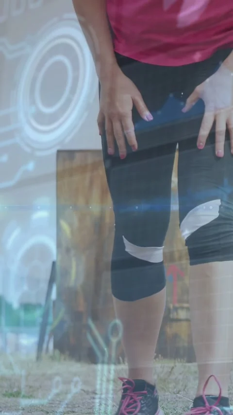 Vertical video: Runner shifting, reaching, fastening knee strap while HUD Stock Footage 332734908
