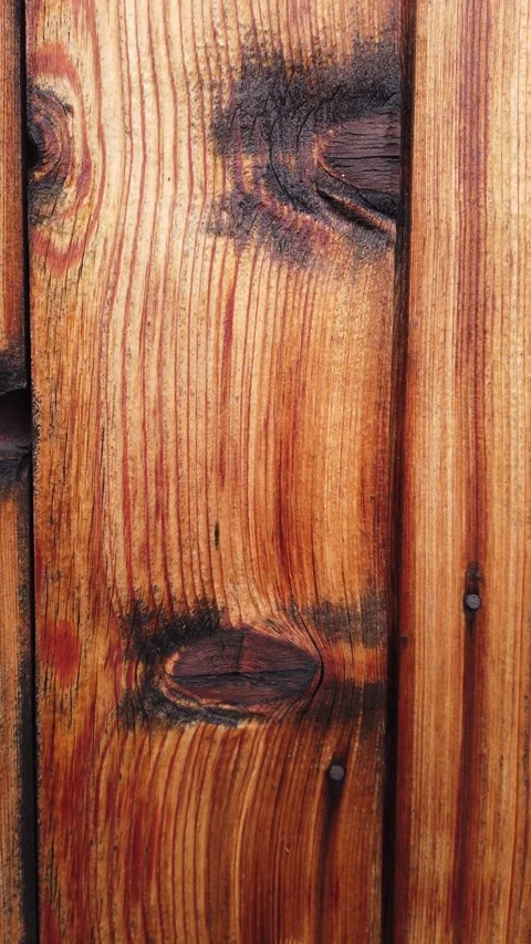 Vertical video of rustic timber knot texture with natural grain patterns Stock Footage 345587742