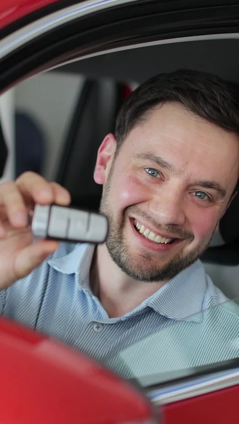 Vertical video Sales manager handing over the keys to man in the car. Stock Footage 337237731