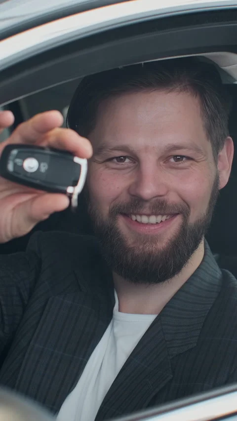 Vertical Video Sales manager handing over the keys to man Stock Footage 337880131