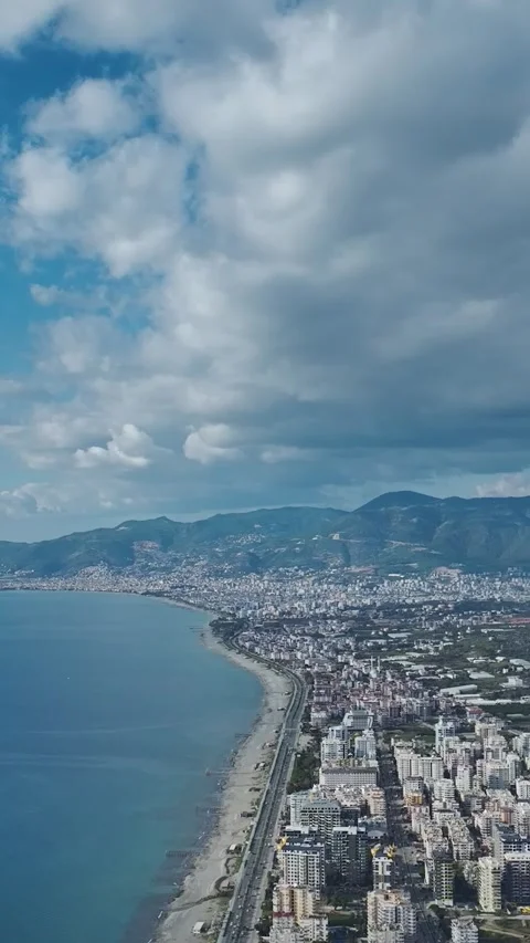 Vertical Video: Scenic Coastal Cityscape Captured From Above With Ocean and Stock Footage 342654635