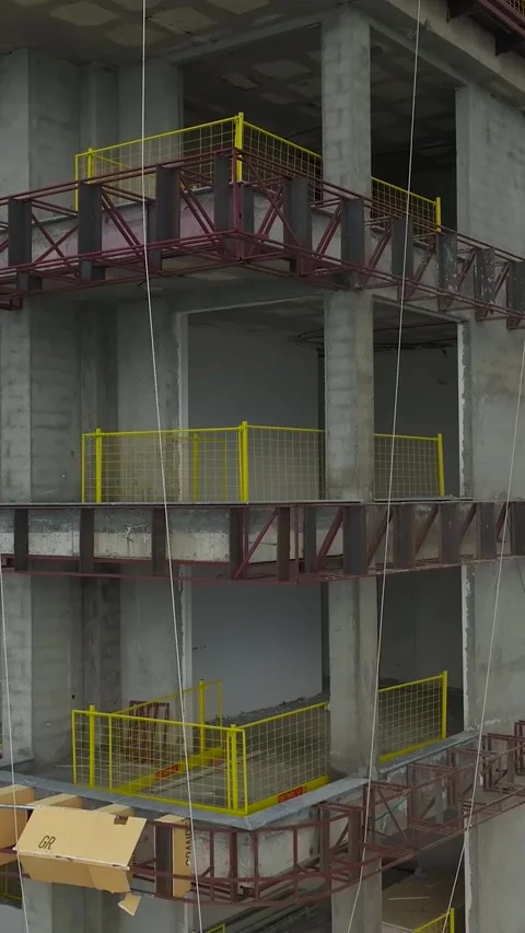 Vertical Video: Scenic Coastal Construction Project With Cranes and Workers Stock Footage 342588013