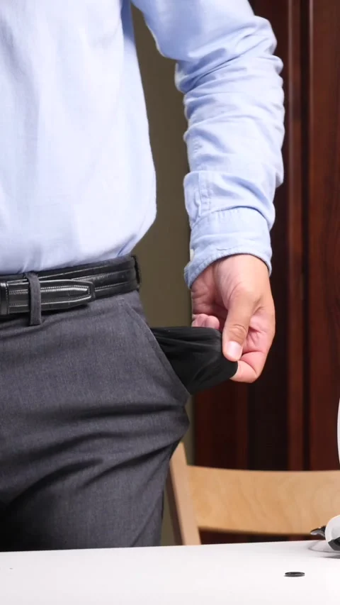 Vertical video Scientist showing empty pockets in laboratory after funding cuts Video stock 314082389