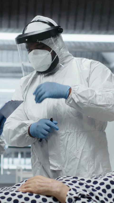 Vertical Video Scientists working in a virology unit with lab testing on Stock Footage 318992036