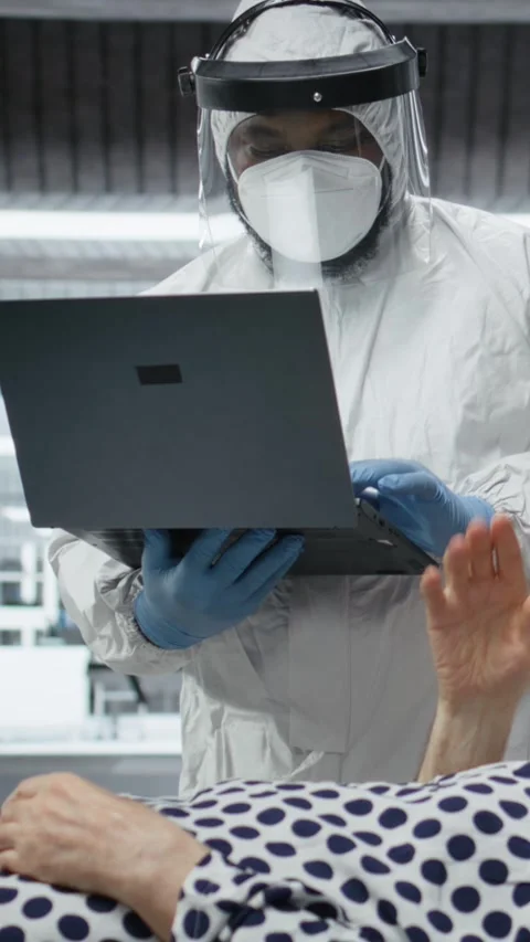Vertical Video Scientists working in a virology unit with lab testing on Stock Footage 318992309