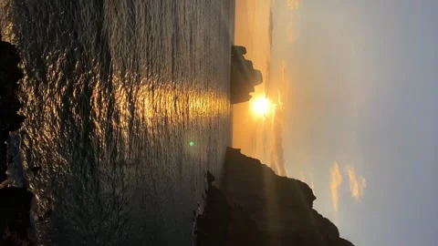 Vertical video sea cliff with sunset on the horizon Stock Footage 251796262